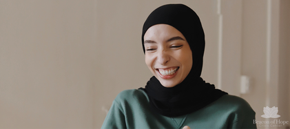 Woman smiling wearing a hijab