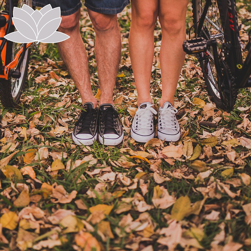 Bicycles and the shoes of two teens.